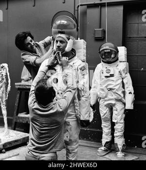 Madame Tussauds staff put the finishing touches to waxwork models of astronauts Neil Armstrong (front) and Buzz Aldrin ahead of display (starting 16th July), to commemorate the anticipated moon landing, Pictured Tuesday 15th July 1969. Our Picture Shows ... sculptor Jean Fraser assisted by David Tomkins.  NOTE : Pictures taken with a Hasselblad Data Camera, similar to two Cameras which will be taken to and left on the moon. Only the film magazines will be bought back, to reduce weight. Stock Photo