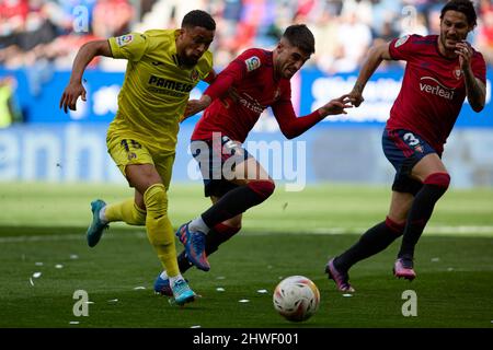 Pamplona, Spain. 05th Mar, 2022. Arnau Danjuma (forward; Villarreal CF) and Nacho Vidal (defender; CA Osasuna) in action during the Spanish La Liga Santander football match between CA Osasuna and Villrreal CF at the Sadar Stadium. (CA Osasuna won: 1 - 0) (Photo by Fernando Pidal/SOPA Images/Sipa USA) Credit: Sipa USA/Alamy Live News Stock Photo