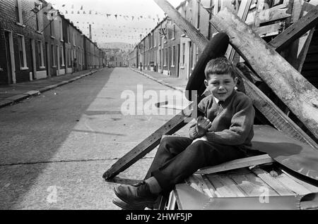 Street party in Balkan Street, Belfast. The party was organised after the street was hit by riot just a week ago after fighting broke out following the army discovering a cache of arms in the road. The party was organised for the children who had to stay in their homes because of a curfew imposed during the riots. 12th July 1970. Stock Photo