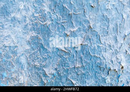 Blue paintwork peeled on an old wall with paint weathered Stock Photo