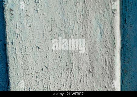 white and blue rough paintwork over the concrete wall Stock Photo