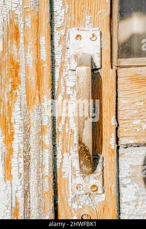 Typical soviet simple door handle on barn door. Stock Photo