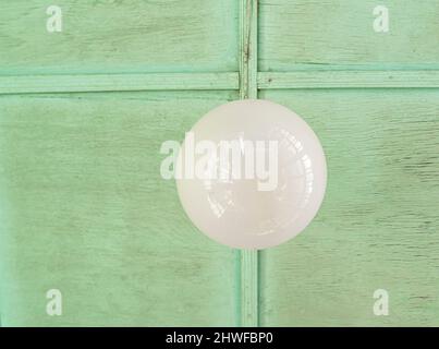 Old dusty celing light fixture in glass abat-jour, common Soviet decor Stock Photo