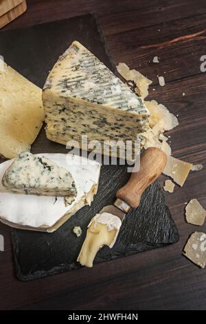 Blue cheese, especially cow's milk, soft cheese, with a strong taste and smell that has characteristic blue-green streaks produced by the type of fung Stock Photo