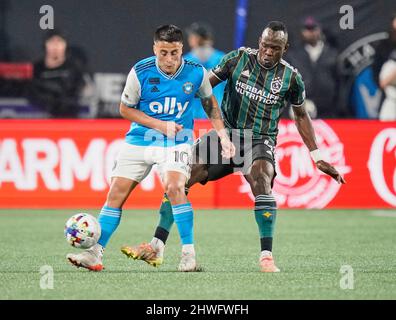 , North Carolina, USA. 5th March, 2022. Charlotte FC forward Cristian Ortiz (10) is guarded by Los Angeles Galaxy defender Sega Coulibaly (4) during an MLS soccer match between the Los Angeles Galaxy and the Charlotte FC on Saturday, March 05, 2022 at Bank of America Stadium in Charlotte, North Carolina. Rusty Jones/Cal Sport Media Stock Photo