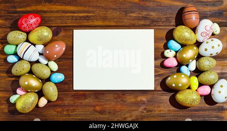 Easter eggs on wooden background . Wooden background. The minimal concept. Top view. Card with a copy of the place for the text. Stock Photo