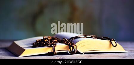 the chain over an open book Stock Photo