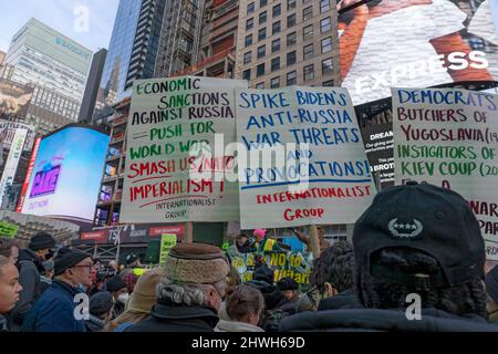 New York, United States. 05th Mar, 2022. Communist protesters holding signs against the US and calling to abolish NATO at the 'Stand With Ukraine' rally in Times Square on March 5, 2022, in New York City. Ukrainians, Ukrainian-Americans and allies gathered to show support for Ukraine and protest against the Russian invasion. (Photo by Ron Adar/SOPA Images/Sipa USA) Credit: Sipa USA/Alamy Live News Stock Photo