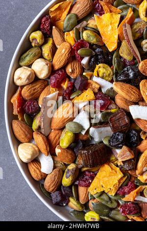 Directly Above shot of Variety of dried fruits and nuts on plate Stock Photo