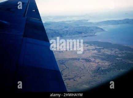 Oblique angle aerial view of Proserpine River mouth, Conway National Park and Whitsunday Islands, Queensland, Australia, 1956 Stock Photo