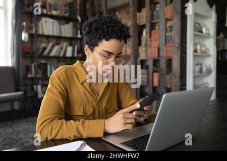 Focused freelance employee working at loft home office workplace Stock Photo
