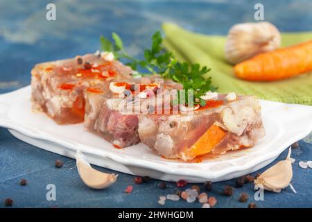 Pihtije - serbian traditional dish - aspic with pork meat and vegetables. Meat jelly - holodets, pihtija or galareta. Stock Photo