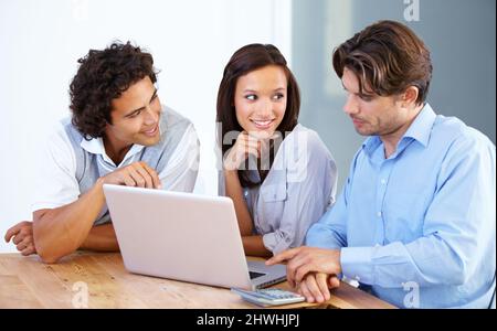 Teamwork to get the job done. A group of young entrepreneurs having a business meeting. Stock Photo