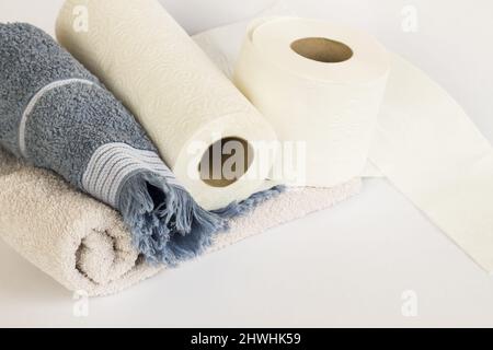 Clean face towels rolled up with paper towels on a white background Stock Photo