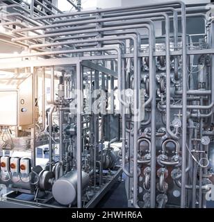 Tubular Aseptic UHT Pasteurizer with Vacuum Deaerator. Food industry. Stock Photo