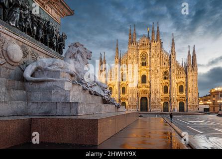 Milan, Italy at the Milan Duomo and Statua di Vittorio Emanuele II at twilight. Stock Photo