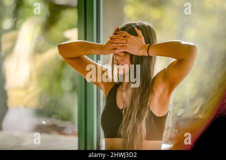 Young pretty european female,meditating, in Third Eye Chakra at a cacao ceremony Stock Photo