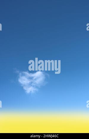 Heart shaped cloud on bright blue sky. Stock Photo