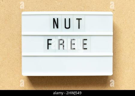 Lightbox with word nut free on wood background Stock Photo