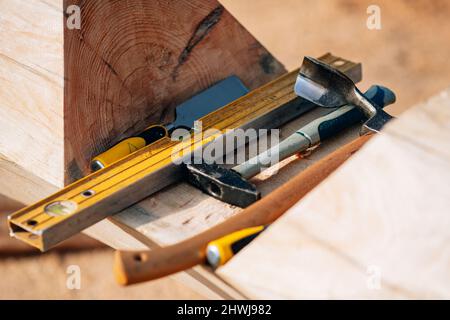 Tool for working on wood chisel, mallet, chainsaw. Stock Photo