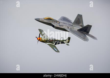 F22 Raptor and P-51 Mustang perform US Air Force Heritage Flight at the Royal International Air Tattoo 2017 Stock Photo