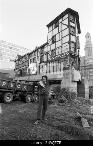 Manchester's oldest building, the Shambles, is rising to new heights, but it's not quite as easy as ganger man Pat Hegarty makes it look. The building has been raised five feet on hydraulic jacks and a service road to an underground car park is being taken underneath in the new city centre development area. 27th October 1971. Stock Photo