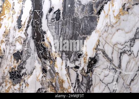 Texture of natural white-gray quartz stone with beige mineral inclusions. Stock Photo