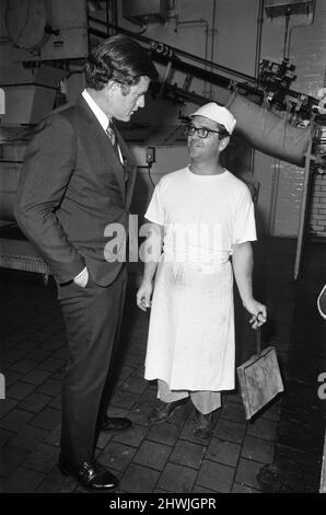 Senator Edward Kennedy seen here chatting to a member of the work force during his tour of the Cadbury Schweppes factory in Bournville. The Senator was in the Midlands as part of his five day tour of the UK. 13th September 1971 Stock Photo