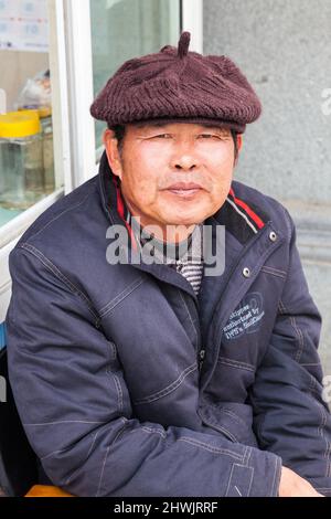 Portrait of a man with a woolen beret. Jiashan, China Stock Photo