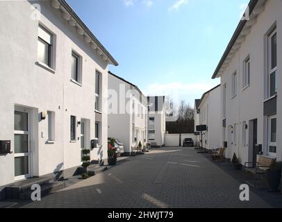 avenue with newly built semi detached housing Stock Photo