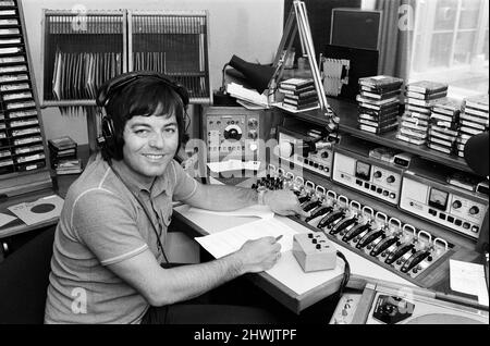 BBC Radio Disc Jockey Tony Blackburn pictured in the studio. 21st June 1973.