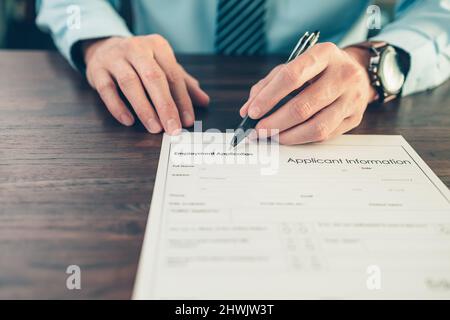 HR staff Submit a job application for new employees to fill out job application documents. job vacancy, job application concept. Stock Photo