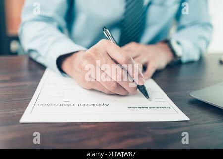 new employees to fill out job application documents. job vacancy, job application concept. Stock Photo