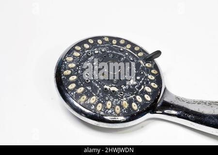 Limescale on shower head isolated on grey background Stock Photo