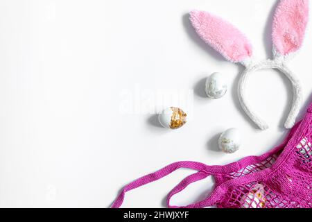 Festive Easter background with eggs and string bag, copy space. Stock Photo