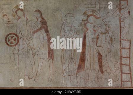 Descent from the Cross or Deposition of Christ an old fresco from the 1300s on the east wall in Orslev church, Denmark, August 9, 2021 Stock Photo