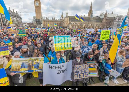 London, UK. 6th Mar, 2022. Large crowd gathers outside the Palace of Westminster in London to protest against the Russian invasion of Ukraine. Demonstrators hold Ukrainian flags and signs demanding stronger international action, including calls for a no-fly zone, NATO intervention, and full sanctions against Russia. People gather in Parliament Square to show solidarity and protest at the ongoing crisis in Ukraine. Penelope Barritt/Alamy Live News Stock Photo