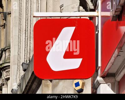 Cardiff, Wales, UK, February 25, 2022 : Ladbrokes logo advertising sign outside its retail business betting shop in the city centre, stock photo image Stock Photo
