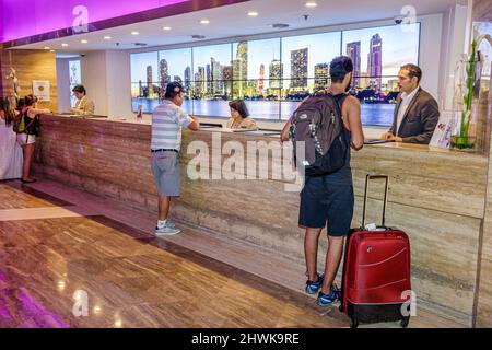 Miami Florida,Intercontinental Hotel lobby,front desk check in reception reservations register guests checking clerks staff Stock Photo