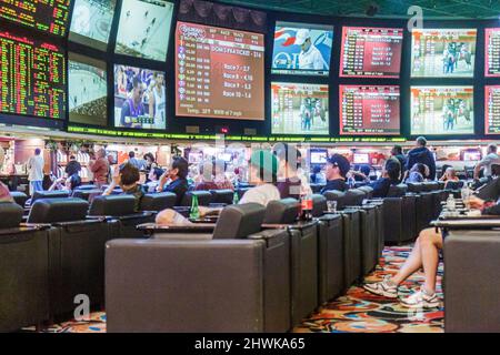 Las Vegas Nevada,Westgate Las Vegas Resort & Casino,sporting events sportsbook,betting odds gamblers gambling monitors live watching inside interior Stock Photo