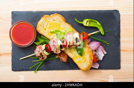 Mutton slices on barbecue skewers Stock Photo