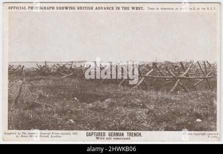 'Captured German trench. Wire not destroyed': 'Official photograph showing British advance in the West' taken by permission of the Commander in Chief of the British Expeditionary Force (BEF), supplied by The Sport & General Press Agency Ltd., 45 Essex Street, Strand, London. View of barbed wire barricades on the Western Front Stock Photo