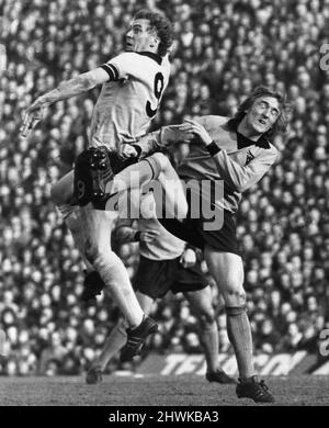 Wolves v Coventry FA Cup 6th round match at Molineux March 1973.  Derek Parkin of Wolves (right) is beaten to the ball by Coventry's Colin Stein.  Final score:  Wolverhampton Wanderers 2-0 Coventry City Stock Photo