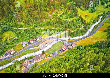 Stelvio pass road and river in Stilfs village, Dolomites Alps in province of South Tyrol in northern Italy Stock Photo