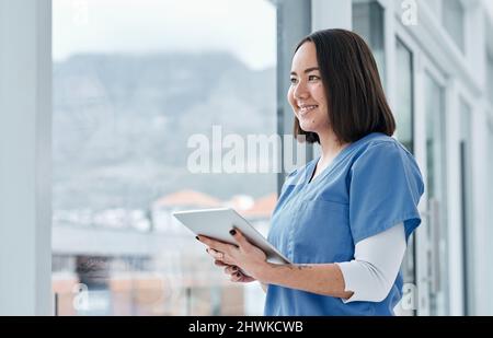 Facilitating effective data management with smart tech. Shot of a medical practitioner using a digital tablet in a hospital. Stock Photo