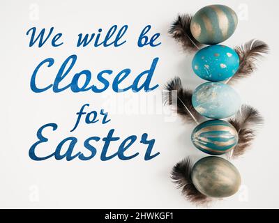 Signboard with the inscription We will be closed for Easter Stock Photo