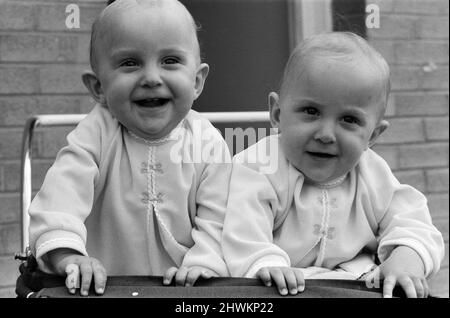 Twin sisters Anna (right) and Barbara Rozycki, at home in Coventry, like doing everything together. As playmates they're inseparable. The girls are a bonny pair now. But when they were born nearly a year ago last May there were fears for their survival, for the girls are Siamese twins. They were joined at the chest and abdomen. They day after they were born they had emergency surgery at Birmingham Children's Hospital. It was a great success. 16th May 1971. Stock Photo