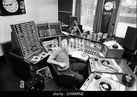 BBC Radio Disc Jockey Tony Blackburn pictured in the studio. 21st June 1973.