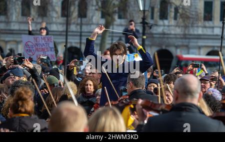 London, England, UK. 6th Mar, 2022. Musicians play for peace in Ukraine in Trafalgar Square under the direction of maestro Petr Limonov. (Credit Image: © Tayfun Salci/ZUMA Press Wire) Credit: ZUMA Press, Inc./Alamy Live News Stock Photo