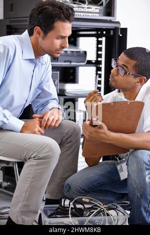 IT knows best. A young IT specialist ready to fix a server. Stock Photo